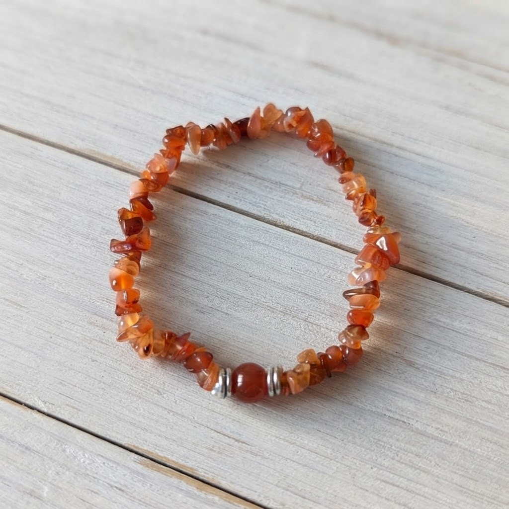 Close-Up of Natural Carnelian Gemstone Bracelet with Translucent Orange Crystal Chips and Silver Spacers Worn on Wrist | OneTrend Jewelry