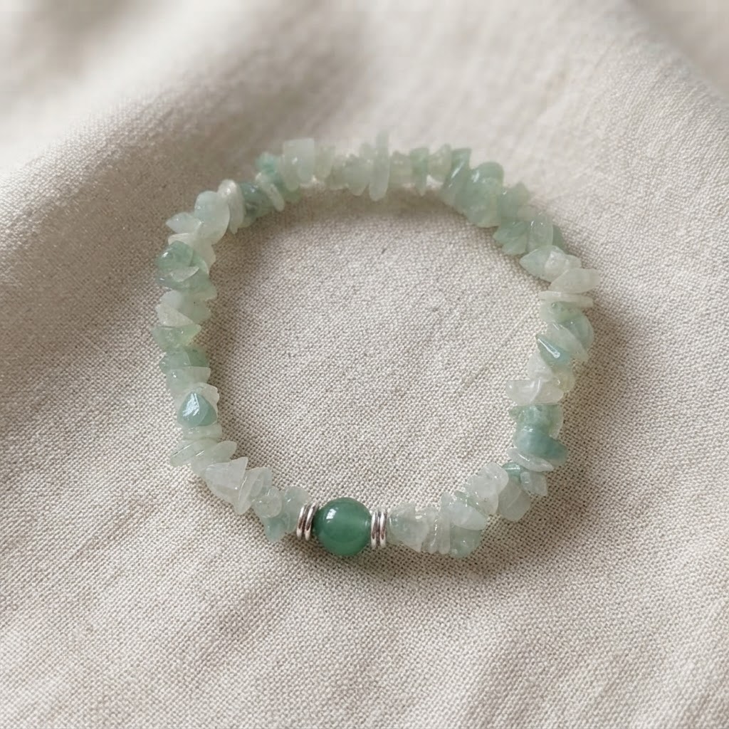 Light Green Aventurine Gemstone Chip Stretch Bracelet with Polished Green Bead and Silver Accents on Beige Fabric | OneTrend India
