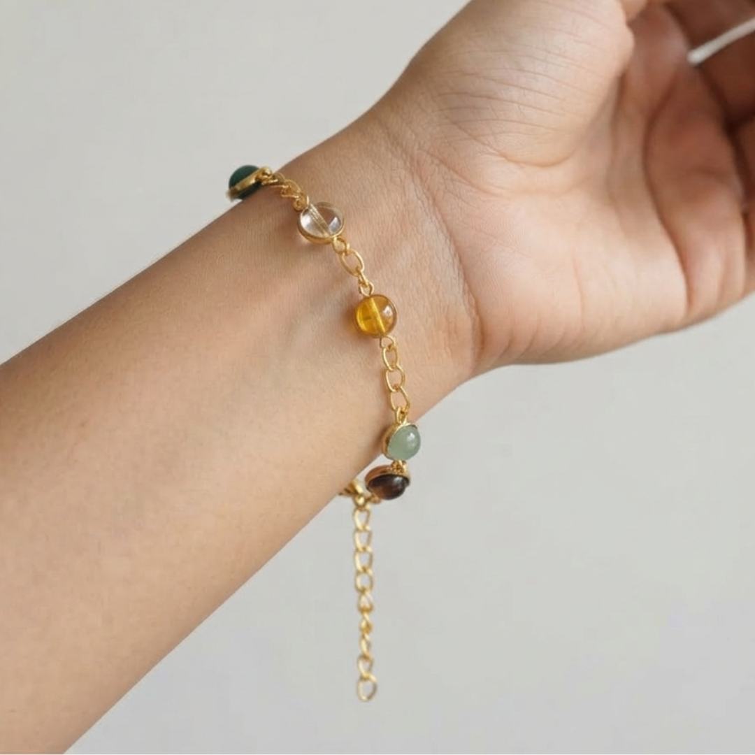Gold Tone Bracelet With Multicolor Gemstone Beads Shown In Hand