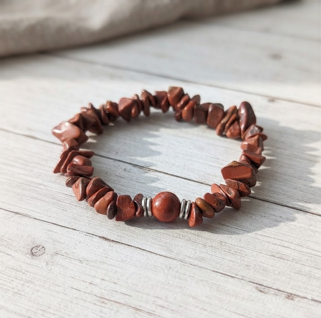 Close-Up of Red Jasper Stone Chip Beaded Bracelet with Round Center Stone and Silver Accents on Wooden Surface | OneTrend Jewelry