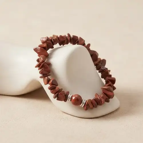Red Jasper Crystal Chip Beaded Bracelet with Polished Center Bead Displayed on White Jewelry Stand – Natural Stone Bracelet | OneTrend India